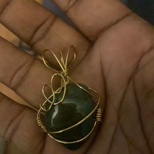 Beautiful olive deep green statement pendant with gold swirl wire
